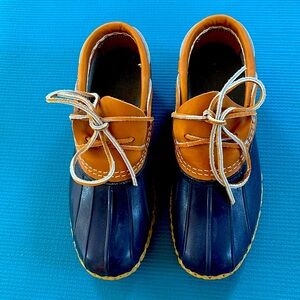 Never worn!  L.L. Bean classic bean boots, rubber mocs